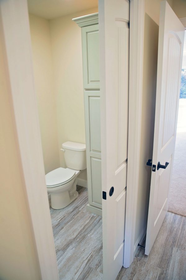 Jack & Jill bathroom on 2nd floor with a pocket door closing off the vanity area & shower area from the toilet. 