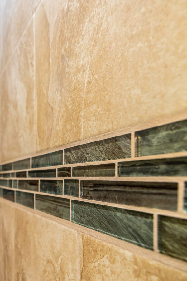 A close-up of the custom tile in the shower