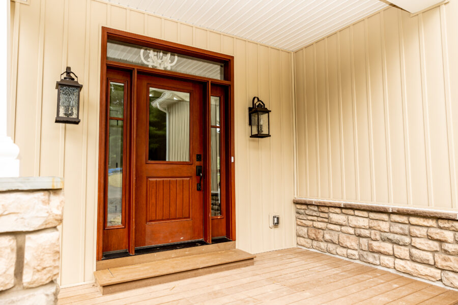 The front door to a custom-built home with stone details